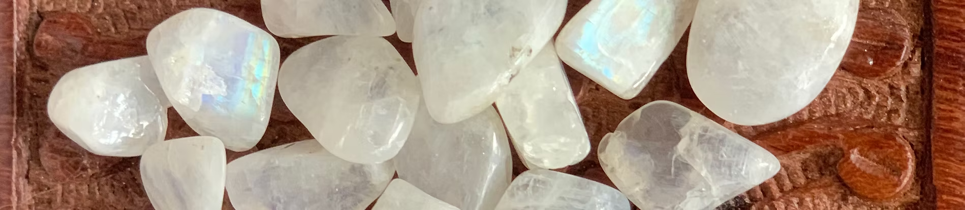 Moonstone crystals on wooden background